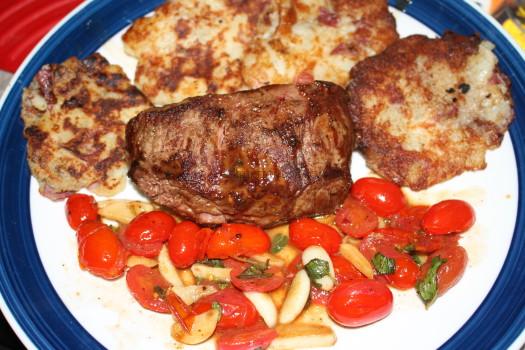 Pan-Seared Steak with Garlic-Tomato Sauce and crispy Parmesan potato cakes