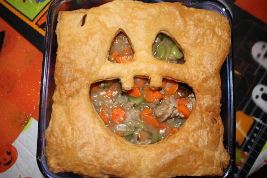 Spooky Turkey Cauldron Pie with vegetables and puff pastry