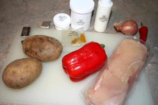 Pan-Seared Chicken and Samosa-Style Potatoes with ginger cream sauce and roasted red peppers